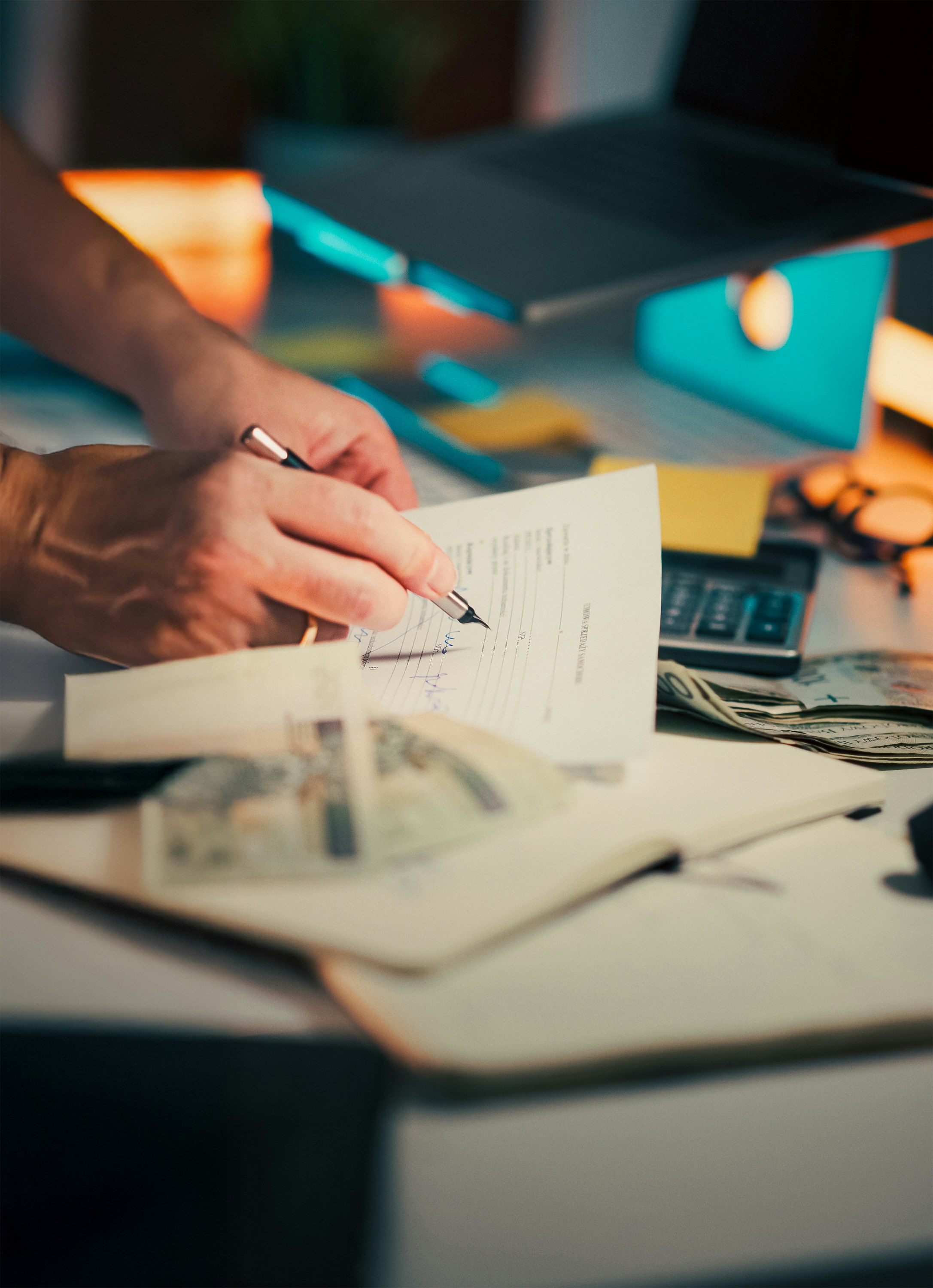 Parent signing a child travel consent letter before a notary public